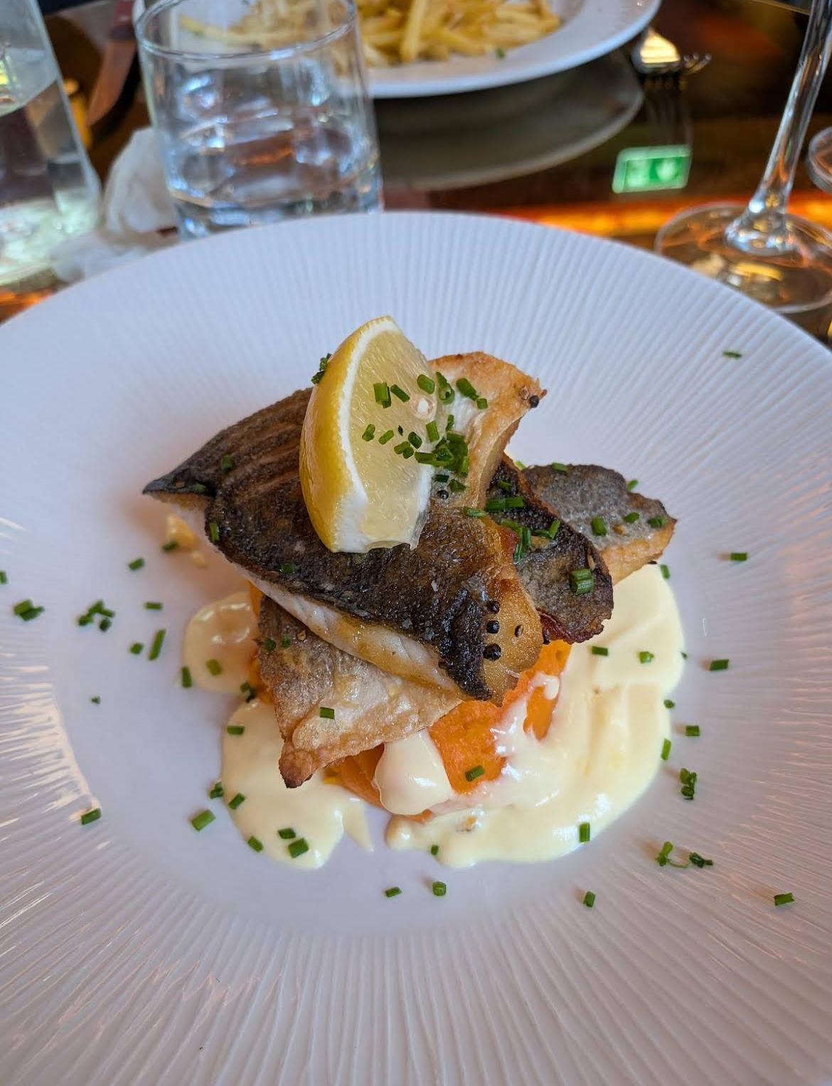 Crisp-skinned fish with lemon and velouté
